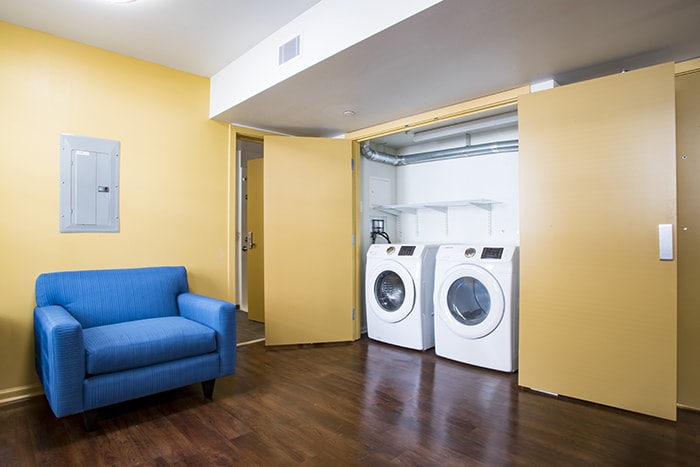 Highlands Apartments ADA Living Area and Laundry - chair and washer and dryer